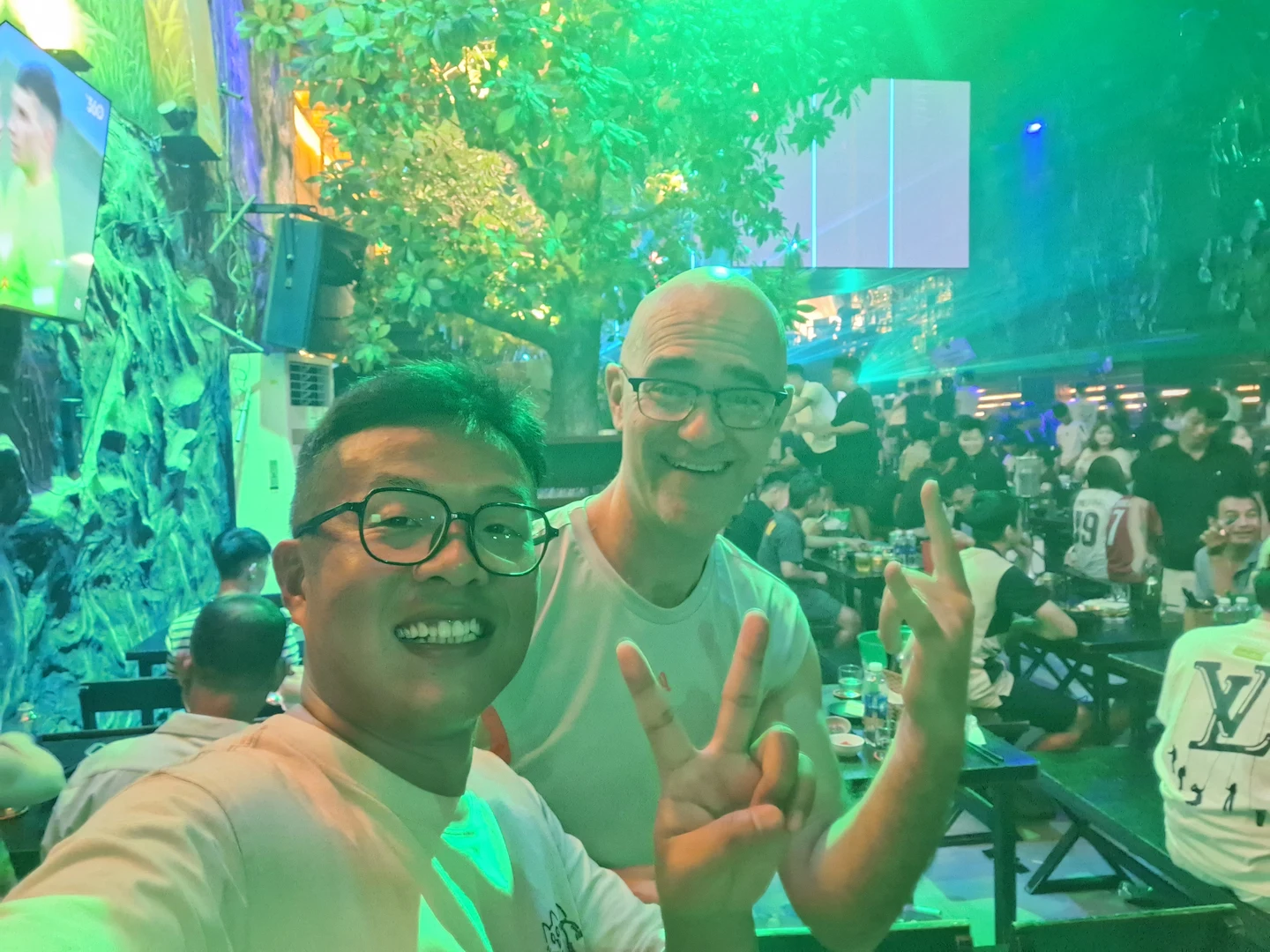 Vibrant Nightlife and Local Pub in Hue · Energetic midnight scene with colorful lights